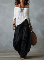 Mara • Conjunto blusa blanca hombros descubiertos y pantalón palazzo negro