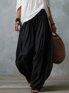 Mara • Conjunto blusa blanca hombros descubiertos y pantalón palazzo negro