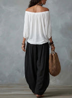 Mara • Conjunto blusa blanca hombros descubiertos y pantalón palazzo negro